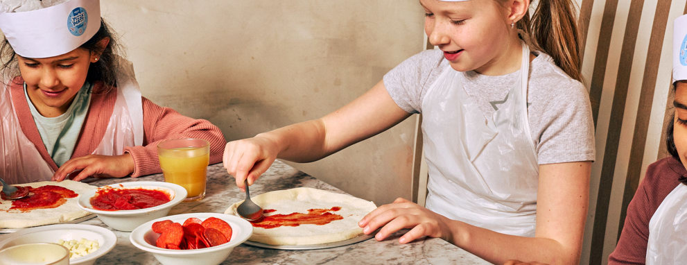 Someone eating pasta and a salad at Prezzo